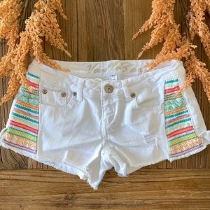 White distressed shorts